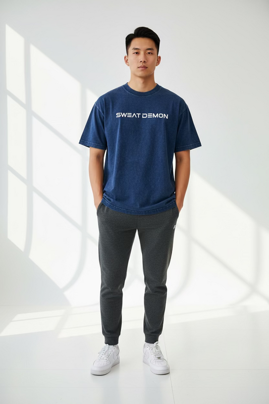 Blue t-shirt with 'SWEAT DEMON' text on a white background
